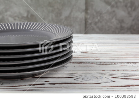 Wooden kitchen counter with new dishware on it Wooden kitchen counter with new dishware on it 100398598