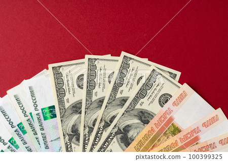 US Dollar and Russian Ruble banknotes close up 100399325