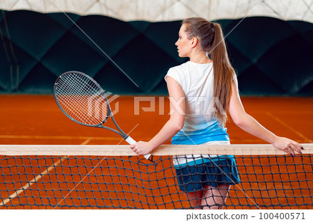Portrait of a woman professional tennis player 100400571