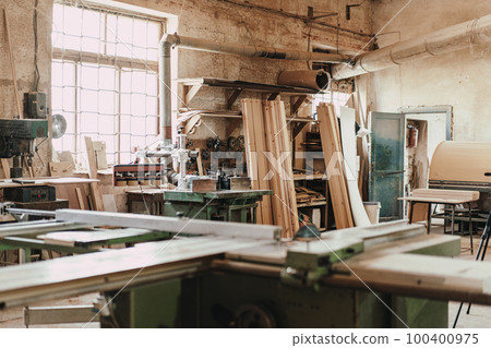 Carpentry shop interior with wood and tools 100400975