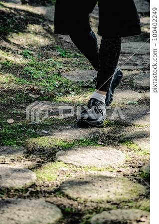 Athlete running feet 100402249