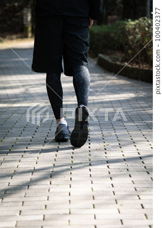 Athlete running feet 100402377