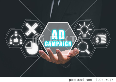 Ad Campaign concept, Business person hand holding ad campaign icon on virtual screen. 100403047