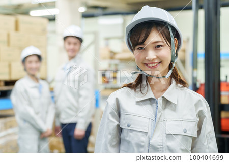Portrait of a female worker working in a warehouse 100404699