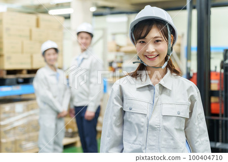 Portrait of a female worker working in a warehouse Portrait of a female worker working in a warehouse 100404710