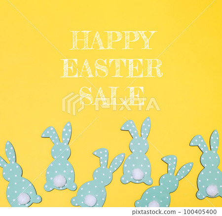 decorated easter bunnies as background and holiday card, top view. 100405400