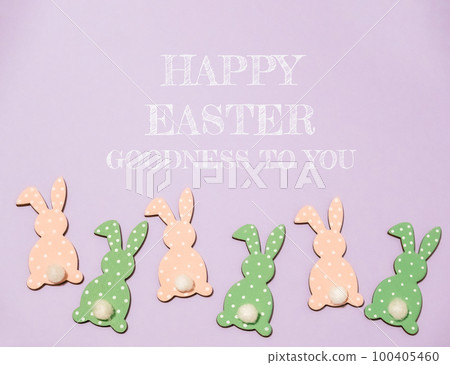 Happy Easter greeting card. At the bottom are multi-colored Easter bunnies. Happy Easter greeting card. At the bottom are multi-colored Easter bunnies. 100405460