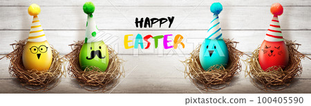 Easter background with colorful easter eggs on wooden background. 100405590