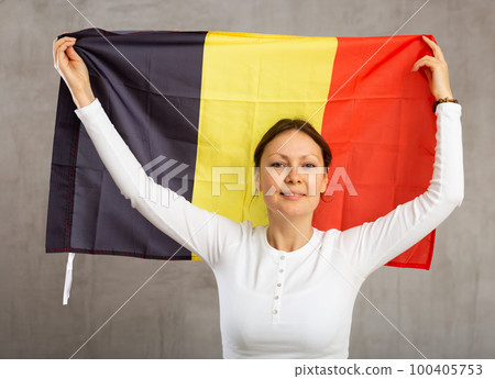 Portrait of happy woman of Belgium match waving national flag Portrait of happy woman of Belgium match waving national flag 100405753