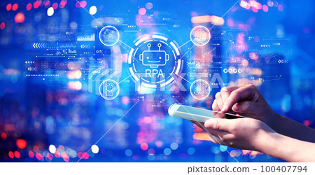 Robotic Process Automation theme with person using a smartphone at night 100407794