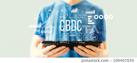 CBDC theme with man using a tablet CBDC theme with man using a tablet 100407839