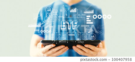ETF theme with man using a tablet ETF theme with man using a tablet 100407958