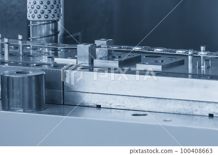 Closeup scene of the progressive die. 100408663