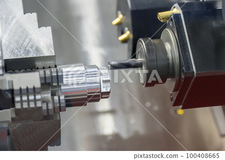 The multi-tasking CNC lathe machine  milling cut the metal shaft parts by milling turret. 100408665