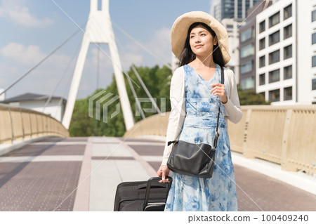 Sakae, Nagoya: A young woman wearing a dress... - Stock Photo