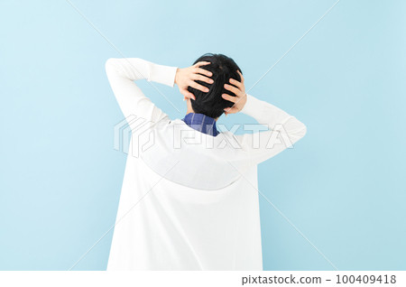 Worried woman back view Worried woman back view 100409418