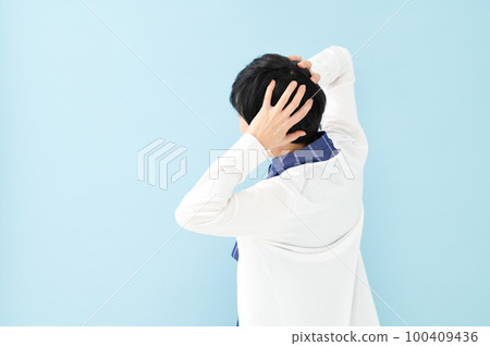 Worried woman back view 100409436