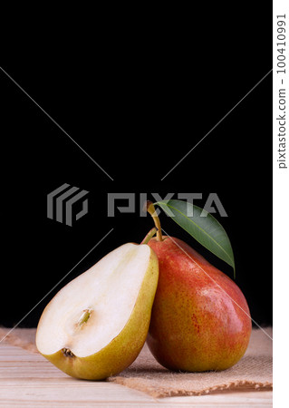 Sweet pears in the basket 100410991