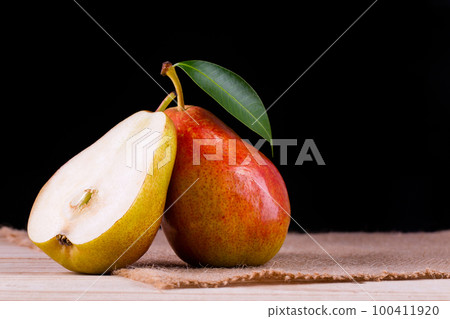 Sweet pears in the basket 100411920