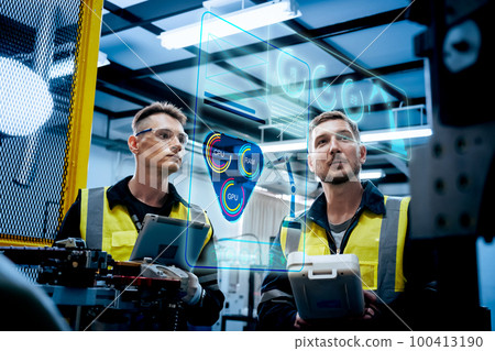 Multiracial technicial engineer training with robot arm Multiracial technicial engineer training with robot arm 100413190