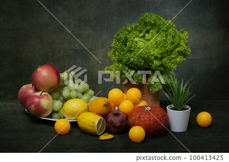 Still life with fruits and vegetables, plants and balls 100413425