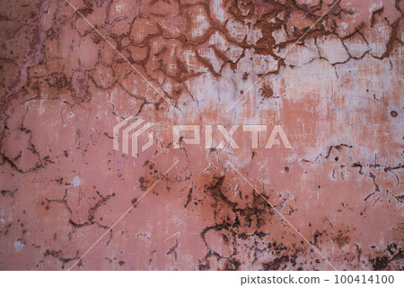 The texture of an old rustic wall is covered with pink stucco 100414100