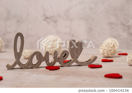 Wooden word love with heart romance. Minimal concept of greeting card for Valentine's Day, Mother's Day, Women's Day Festive holiday card concept Wooden word love with heart romance. Minimal concept of greeting card for Valentine's Day, Mother's Day, Women's Day Festive holiday card concept 100414236