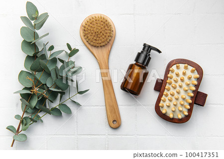 Spa treatment concept. natural spa cosmetics products with eucalyptus oil,, massage brush, eucalyptus leaf. 100417351