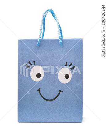 Blue paper shopping bag with smiling funny face Blue paper shopping bag with smiling funny face 100420144