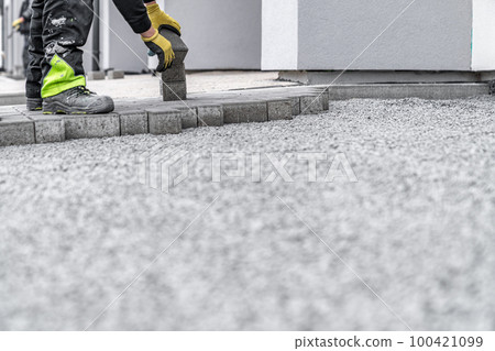 construction of a sidewalk from concrete blocks 100421099