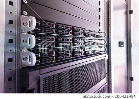 Row of hard drives serving as data storage inside server room Row of hard drives serving as data storage inside server room 100421494