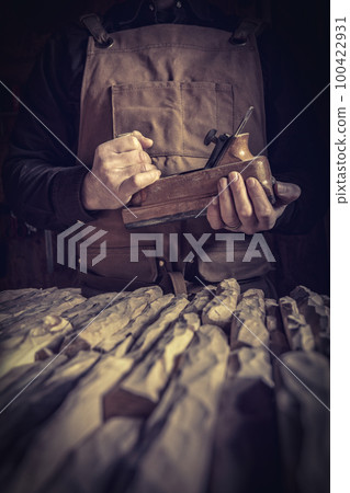 carpenter holding a planer carpenter holding a planer 100422931
