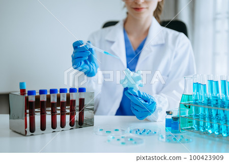 Coronavirus COVID-19 medical test vaccine research and development concept.in the chemistry lab. 100423909