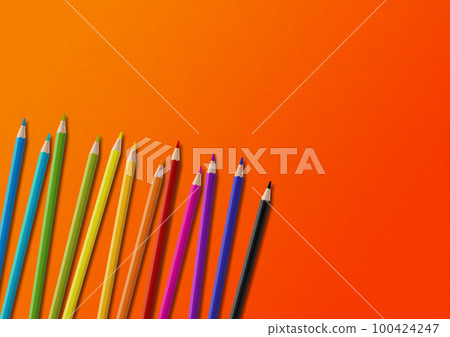 Colored pencil group isolated on orange. Horizontal background 100424247