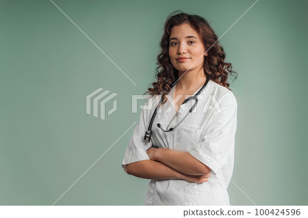 Portrait of young curly nurse, studio shoot. Portrait of young curly nurse, studio shoot. 100424596
