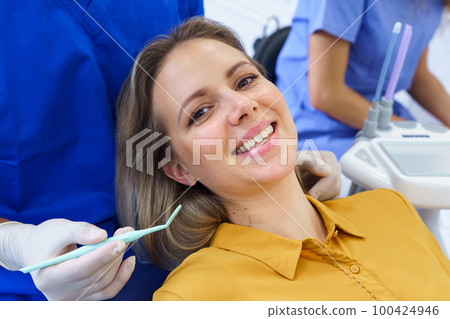 Portrait of young woman in dentist chair. Portrait of young woman in dentist chair. 100424946