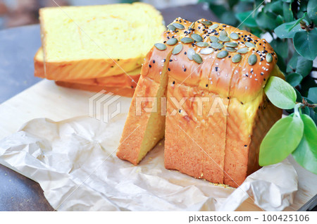 bread , pumpkin bread or loaf of bread or sliced bread or cut bread with pumpkin seed and sesame bread , pumpkin bread or loaf of bread or sliced bread or cut bread with pumpkin seed and sesame 100425106