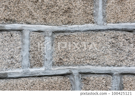 Stone of gray granite color with finishing with guide lines of cement of gray shade. Sunny weather, day. Stone of gray granite color with finishing with guide lines of cement of gray shade. Sunny weather, day. 100425121