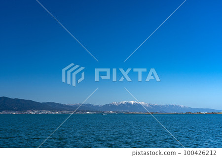 View of Lake Biwa in winter from Yabashi Kihojima Park and the shoreline of the west side of the lake View of Lake Biwa in winter from Yabashi Kihojima Park and the shoreline of the west side of the lake 100426212
