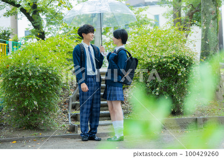 High school student couple rain High school student couple rain 100429260