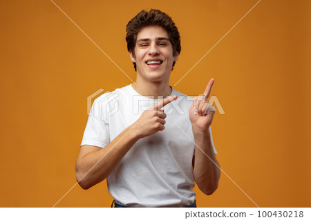 Young handsome man over blue background pointing to the side Young handsome man over blue background pointing to the side 100430218