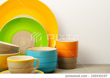 Set of colored ceramic dishware front view Set of colored ceramic dishware front view 100430297