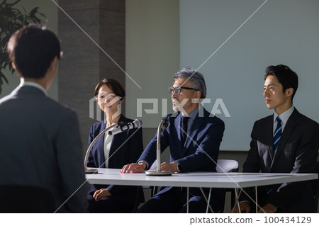A man with gray hair that looks like a press conference A man with gray hair that looks like a press conference 100434129