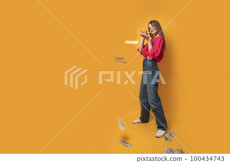 Girl in full growth throw dollar bills around. Teenager overspend. Copy space. Girl in full growth throw dollar bills around. Teenager overspend. Copy space. 100434743