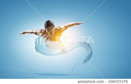 Professional man swimmer on a wave Professional man swimmer on a wave 100435376