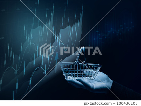 A female hand holding a miniature shopping basket and a chart with growing indicators, analysis of the market, high business profitability. A female hand holding a miniature shopping basket and a chart with growing indicators, analysis of the market, high business profitability. 100436103