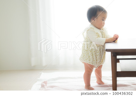Baby standing up Baby standing up 100436302