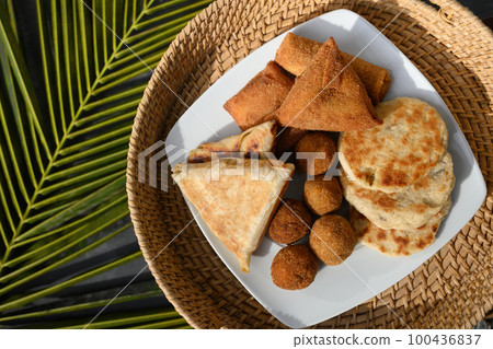 Sri Lankan different street food, vegetable and coconut roti, cutlets, snack. 100436837