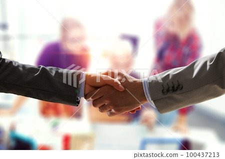 Three co-workers working together . Mixed media 100437213