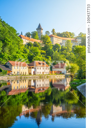 Jakobinka Tower - a remnant of the extinct Upper Rozmberk Castle. Morning view from the Vltava riverbank in Rozmberk nad Vltavou, Czech Republic Jakobinka Tower - a remnant of the extinct Upper Rozmberk Castle. Morning view from the Vltava riverbank in Rozmberk nad Vltavou, Czech Republic 100437733